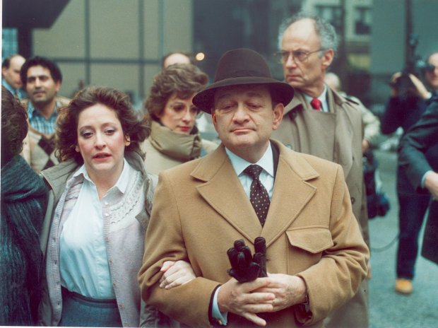 Judge Reginald Holzer leaves federal court with his daughter, Bambi, in 1986 after a jury found him guilty of corruption. (Frank Hanes/Chicago Tribune)