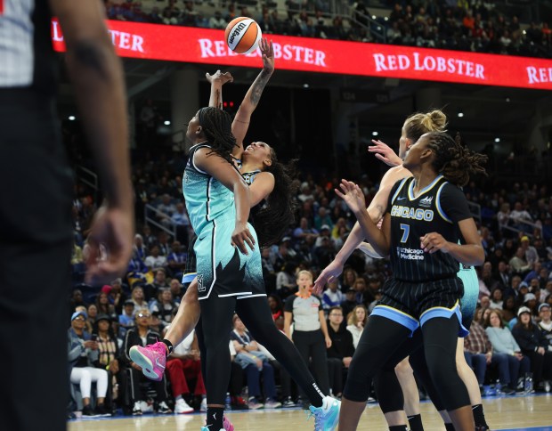 Sky center Kamilla Cardoso, center, is blocked in the first quarter against the Liberty at Wintrust Arena on May 22, 2025, in Chicago. (John J. Kim/Chicago Tribune)