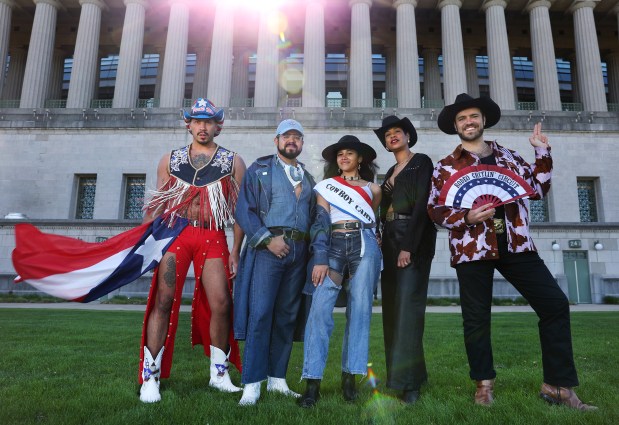 Beyoncé fans, from left, Ivan Adorno, Pedro Guerrero, Jo Caynon, Ronda Joubert, and Matthew Serafin outside of Soldier Field in Chicago, on May 8, 2025. All have tickets and are planning on attending one of the Beyoncé concerts during her Cowboy Carter tour stop at Soldier Field May 15-18. (Chris Sweda/Chicago Tribune)