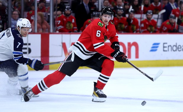 Blackhawks defenseman Sam Rinzel (6) stays focused on the puck in the first period against the Jets on April 12, 2025, at the United Center. (Chris Sweda/Chicago Tribune)