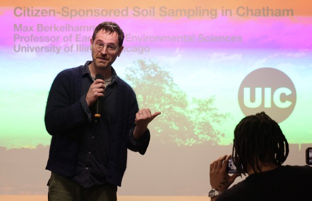 Max Berkelhammer, associate professor of earth and environmental sciences at the University of Illinois Chicago, speaks about the importance of trees in mitigating urban flooding during a citizen science initiative event to address flooding in the Chatham neighborhood, at a community space in the 600 block of East 87th Street, April 12, 2025. (John J. Kim/Chicago Tribune)