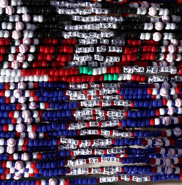 Beaded necklaces for fans of both the Chicago Cubs and the Chicago White Sox are seen for sale outside of Wrigley Field in Chicago before the two teams faced off on May 16, 2025. (Chris Sweda/Chicago Tribune)