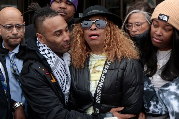 Nicole Banks breaks down after speaking briefly about the death of her son, Dexter Reed, by police at a press conference outside the 11th District Police Station in Chicago on April 24, 2024. (Antonio Perez/Chicago Tribune)