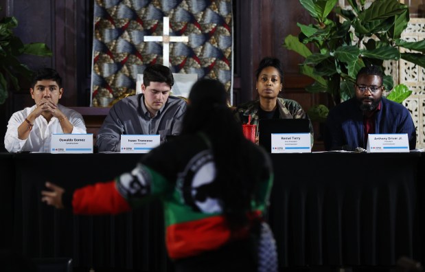 The Community Commission for Public Safety and Accountability board listens as Bella Bahhs speaks about the shooting death of Dexter Reed during the public comment section of the CCPSA meeting on April 25, 2024. (Chris Sweda/Chicago Tribune)