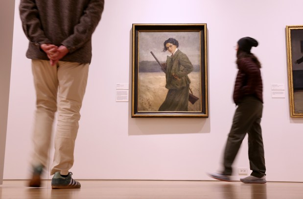 People view Nasta Rojc's "Self-Portrait in a Hunting Suit," 1912, at "The First Homosexuals" exhibit at Wrightwood 659 in Chicago's Lincoln Park neighborhood, May 2, 2025. (Chris Sweda/Chicago Tribune)