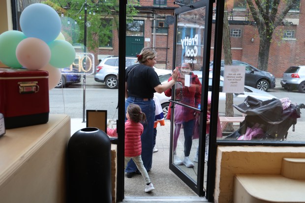 People exit after eating at ice cream Pretty Cool Ice Cream on April 30, 2025. (Terrence Antonio James/Chicago Tribune)
