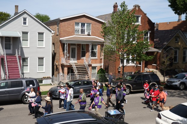 People march in the McKinley Park Memorial Day parade, May 26, 2025. (Antonio Perez/Chicago Tribune)