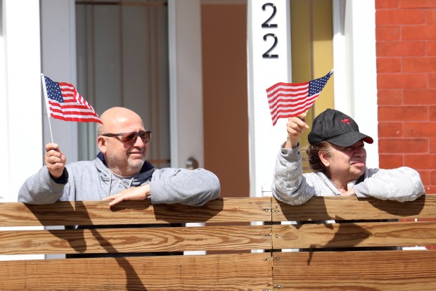 People watch the McKinley Park Memorial Day parade, May 26, 2025. (Antonio Perez/Chicago Tribune)