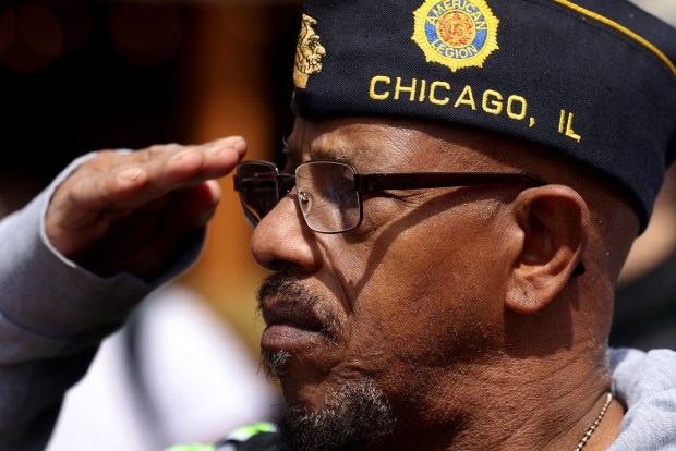 Cmdr. Roy Taylor of American Legion Post 800 salutes at the McKinley Park Memorial Day parade ceremony on May 26, 2025. (Antonio Perez/Chicago Tribune)