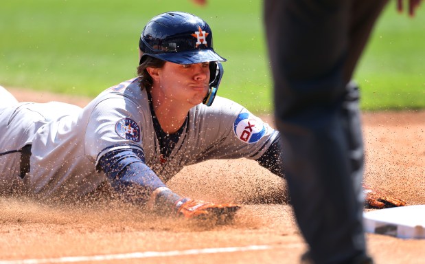 Astros center fielder Jake Meyers slides safely into third base with a two-run triple in the fourth inning against the White Sox on May 3, 2025, at Rate Field. (Chris Sweda/Chicago Tribune)