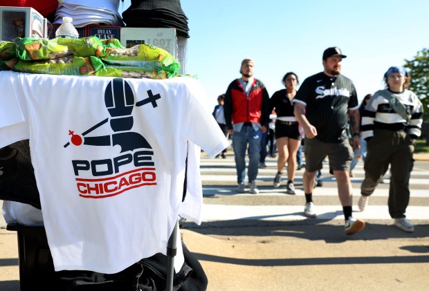 Pope-related White Sox T-shirts are for sale outside of Rate Field before a game against the Marlins on May 10, 2025. Formerly Cardinal Robert Francis Prevost, the new Pope Leo XIV was born in Chicago and raised in Dolton. (Chris Sweda/Chicago Tribune)