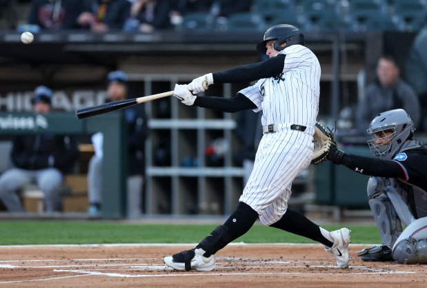 Chicago White Sox designated hitter Andrew Vaughn hits a solo home run in the first inning of a game against the Miami Marlins at Rate Field in Chicago on May 10, 2025. (Chris Sweda/Chicago Tribune)