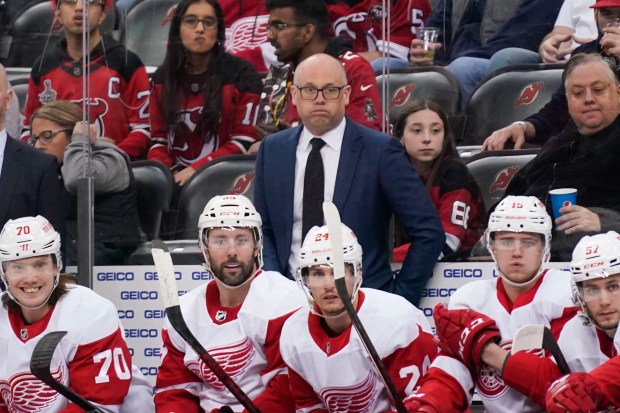 Red Wings coach Jeff Blashill looks over the ice during the first period against the Devils in Newark, N.J., on April 29, 2022. (AP Photo/Seth Wenig)