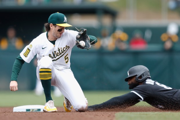 Luis Robert Jr. #88 of the Chicago White Sox slides into second base ahead of a tag by Jacob Wilson #5 of the Athletics to safely steal the base in the top of the seventh inning at Sutter Health Park on April 26, 2025 in Sacramento, California. (Photo by Lachlan Cunningham/Getty Images)