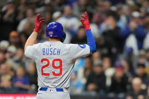 Cubs first baseman Michael Busch celebrates as he rounds the bases after hitting a grand slam during the second inning against the Brewers on May 2, 2025, at American Family Field in Milwaukee. (Patrick McDermott/Getty Images)