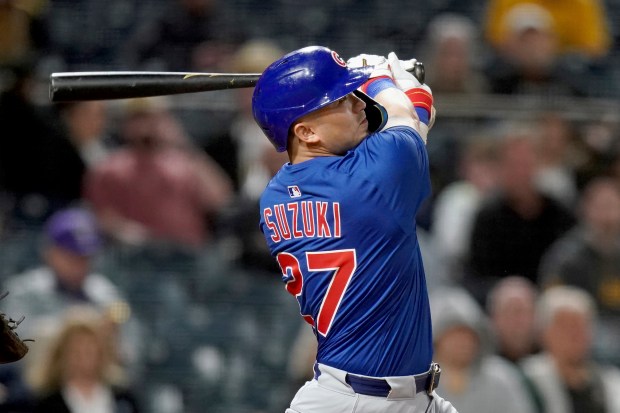Chicago Cubs' Seiya Suzuki hits a two-run home run during the seventh inning of a baseball game against the Pittsburgh Pirates Tuesday, April 29, 2025, in Pittsburgh. (AP Photo/Matt Freed)