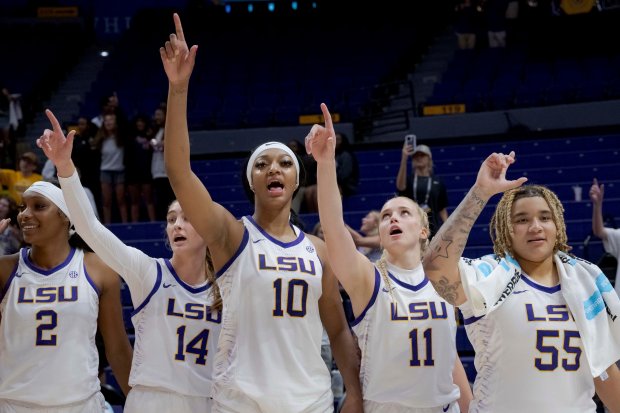 LSU's Amani Bartlett, from left, Mikaylah Williams, Angel Reese, Hailey Van Lith and Kateri Poole sing the school alma mater after an exhibition game against East Texas Baptist on Oct. 26, 2023, in Baton Rouge, La. (Matthew Hinton/AP)