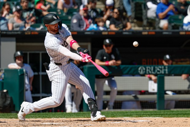 Chicago White Sox's Tim Elko hits a three-run home run against the Miami Marlins during the sixth inning of a baseball game Sunday, May 11, 2025, in Chicago. (AP Photo/Kamil Krzaczynski)