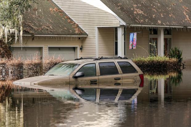 FILE - A neighborhood still flooded from Hurricane Milton prepares to have the FEMA Disaster Recover Center covert to a polling location for the general election on Monday, Nov. 4, 2024, in Ridge Manor, Fla. (AP Photo/Mike Carlson, File)