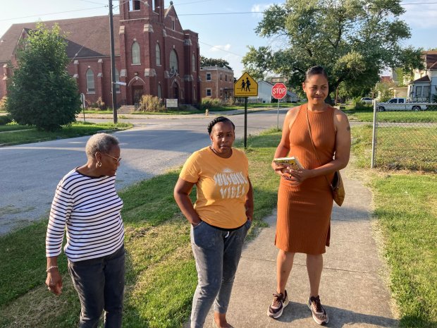 Dorothy Taylor, left, Carlita Poole-Tingley, center, and Harvey 2nd Ward Ald. Colby Chapman stand in August 2023 in the 15300 block of Myrtle Avenue in Harvey. Homes on the block were in the footprint of a flood control project scheduled to begin construction in 2024. (Mike Nolan/Daily Southtown)