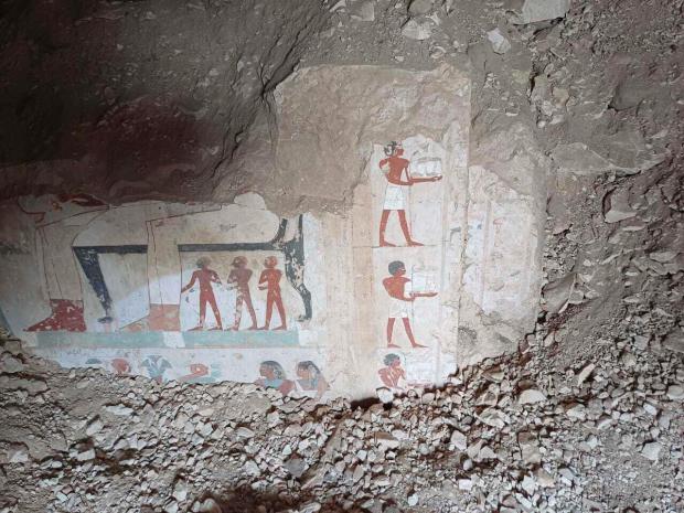 In this undated photo, hieroglyphs are revealed in the three new graves of senior statesmen found in the Dra' Abu al-Naga necropolis area in Luxor, Egypt. (Egypt Ministry of Tourism and Antiquities via AP)