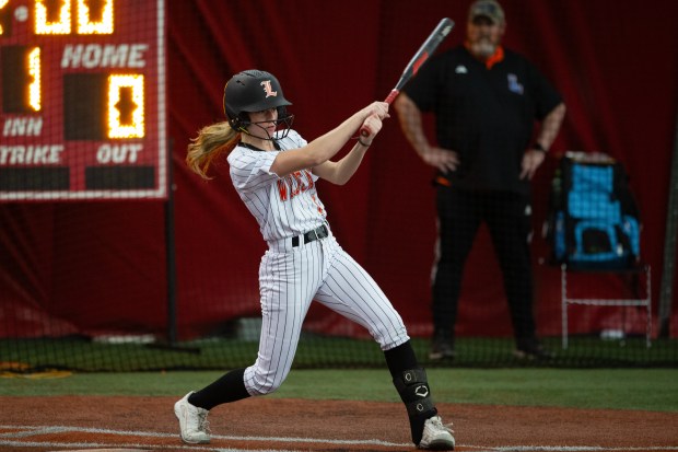 Libertyville's Taylor Higham drives the ball for a base hit