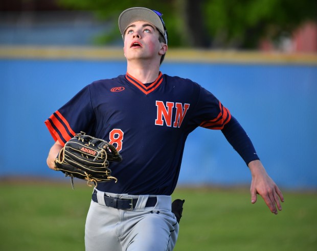 Naperville North right fielder Caden Vorwick keeps his eye on a foul pop-up