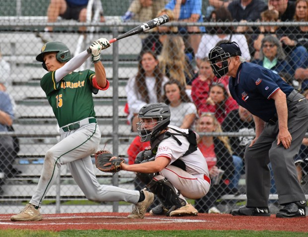 Waubonsie Valley's Danny McGuigan hits a single