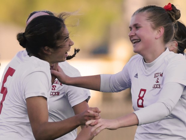 Naperville Central's Eleanor Kane celebrates with teammate Sophia Cochran