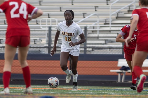 Neuqua Valley's Selma Larbi dribbles the ball