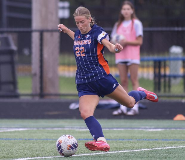 Naperville North's Claire DeCook puts a shot on goal