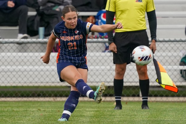 Naperville North's Emily Buescher takes a free kick