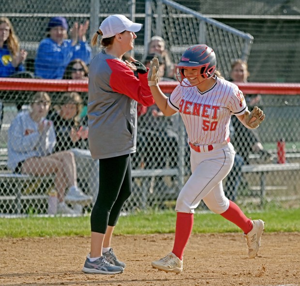 Benet's Bella Iovinelli (50) gets a high-five from coach Janet Royal