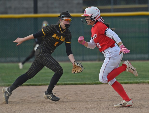 Naperville Central's Natalie Lau runs to third base