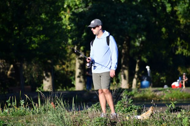 A man fishes at Hidden Lakes Trout Farm in Bolingbrook, where the Forest Preserve District of Will County is planning three fishing events in May. (Forest Preserve District of Will County)