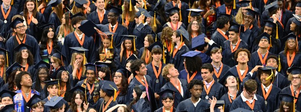 Eye spy a soaring cap or mortarboard. Can you find it at the cap toss? Taken at Evanston Township High School's commencement at Northwestern University's Welsh-Ryan Arena at McGaw Memorial Hall in Evanston on May 18, 2025. (Karie Angell Luc/Pioneer Press)
