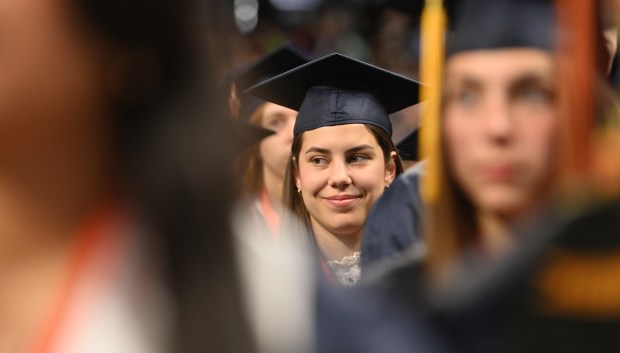 Sally Sloan Beckley smiles during the high note at the end of the national anthem during ETHS commencement at Northwestern University's Welsh-Ryan Arena at McGaw Memorial Hall in Evanston on May 18, 2025. (Karie Angell Luc/Pioneer Press)