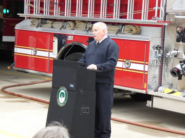Elmhurst Fire Chief Dick Dufort discusses fire service traditions during a May 5 dedication ceremony of the city's new fire engine. (Graydon Megan/Pioneer Press)