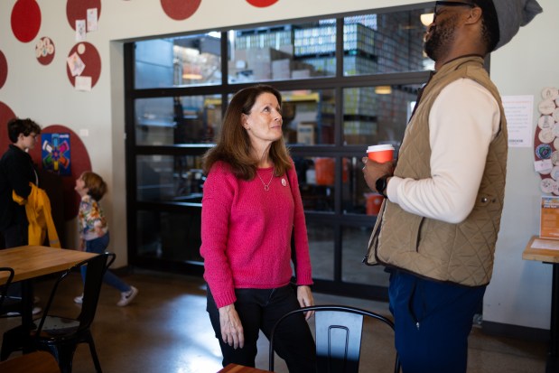 Then Skokie Mayor-elect Ann Tennes talks with Terrence Wilson during a Soul Good Coffee pop-up event at Sketchbook Brewing, April 12, 2025, in Skokie. (Audrey Richardson/Chicago Tribune)
