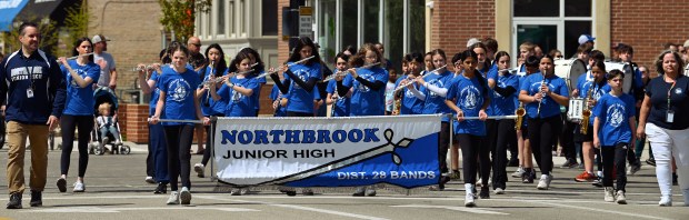The Northbrook Junior High School marching band plays on the Shermer Road parade route on Memorial Day, May 26, 2025 in Northbrook. (Karie Angell Luc/Pioneer Press)
