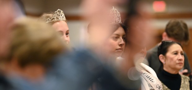 From left to right, watching performers from Libertyville's Improv Playhouse Training Center are Junior Miss Mundelein 2024 Spencer Simple of Mundelein, Miss Mundelein 2024 Natalia Gutierrez of Mundelein, and Mansie O'Leary of Libertyville, executive director of youth programming for Libertyville's Improv Playhouse, at the GLMV Extreme Block Party Family Expo and Taste of the Towns on May 3, 2025 in Mundelein at the DoubleTree by Hilton Hotel Mundelein. (Karie Angell Luc/Pioneer Press)