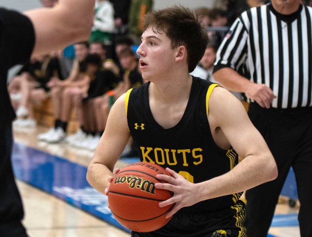 Kouts' Landon Garrett looks to pass the ball
