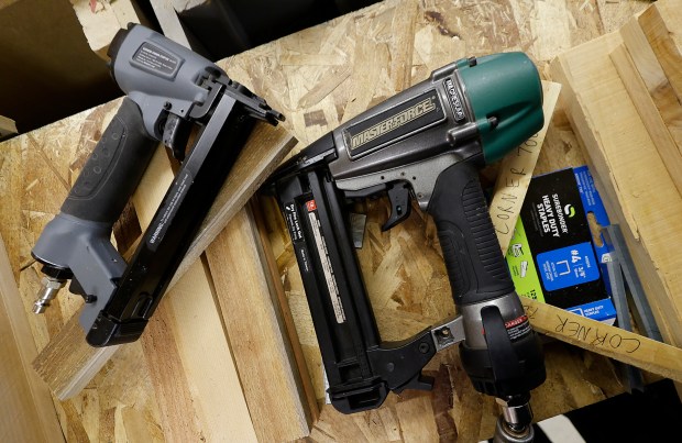 A pair of heavy duty staplers lie in the practice village at the Hammond Career Center on Thursday, May 1, 2025. Four Highland High School seniors will graduate with a carpentry certification and compete nationally in June in Atlanta, Georgia. (John Smierciak / for the Post-Tribune)