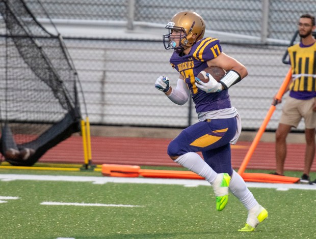 Hobart's Connor Stafford runs with the ball