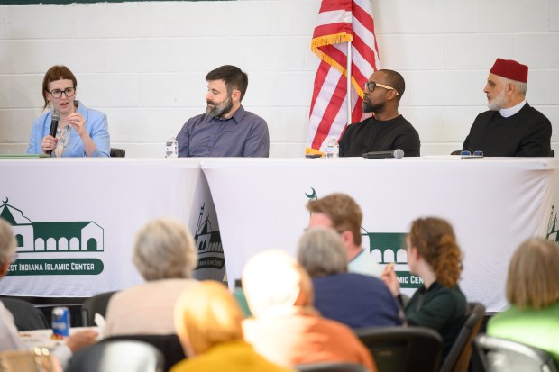 From left, Temple Israel Gary Rabbi Diane Tracht, First Unitarian Church of Hobart Calumet Region Reverend Tom Bozeman, St. Timothy Community Church Pastor Rameem Jackson, and Northwest Indiana Islamic Center Imam Mongy El-Quesny, participate in a panel as local religious leaders and congregants gather to participate in the Northwest Indiana Islamic Center's interfaith potluck event on Friday, May 23, 2025. (Kyle Telechan/for the Post-Tribune)