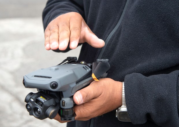 Lake County Sheriff Department deputy commander Reggie Sanders shows one of the department's drones at the East Chicago Marina on Thursday, May 22, 2025. (Michael Gard/for the Post-Tribune)