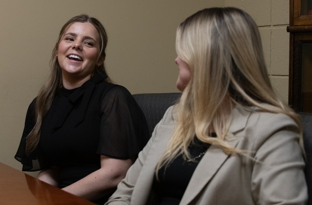 Lake County criminal deputy prosecutor Lauren Lanham smiles while speaking with her sister Lindsey Lanham during an interview at the Lake County Government Center in Crown Point, Indiana, Thursday, May 22, 2025. Lindsey is also a criminal deputy prosecutor in Lake County. (Andy Lavalley/for the Post-Tribune)