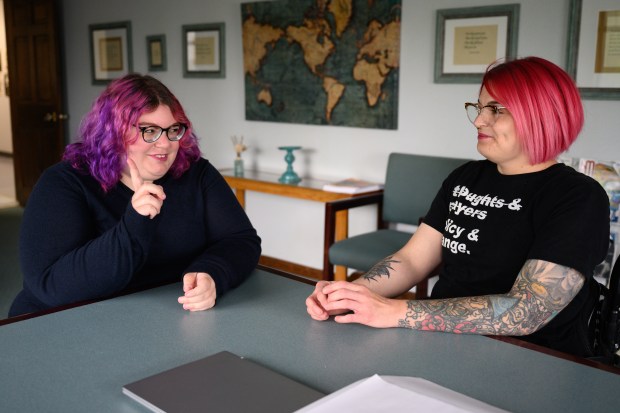Everybody Counts independent living navigators Brianna Fotinos (left) and Jordan Musenbrock, who recently traveled to Washington D.C. to protest federal Medicaid cuts, speak about their time at the capital at the organization's Merrillville office on Wednesday, May 21, 2025. (Kyle Telechan/for the Post-Tribune)