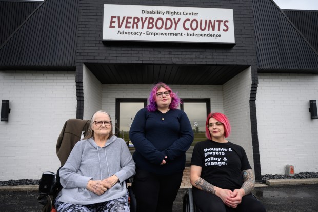 From right, Everybody Counts independent living navigators Jordan Musenbrock and Brianna Fotinos, and program manager Leslie Hawker, pose in front of the organization's Merrillville office on Wednesday, May 21, 2025. Musenbrock and Fotinos recently traveled to Washington D.C. to protest federal Medicaid cuts. (Kyle Telechan/for the Post-Tribune)