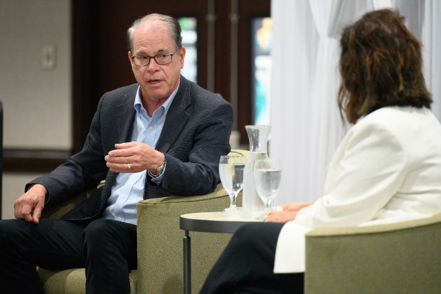 Indiana Governor Mike Braun, left, participates in a fireside chat with Munster Chamber of Commerce Chairperson Katie Sannito during the chamber's May membership meeting on Thursday, May 8, 2025. (Kyle Telechan/for the Post-Tribune)